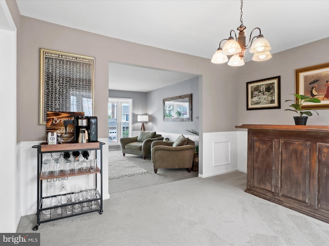 214 Primavera Cir, Sterling, VA 20165 - interior space with light colored carpet, an inviting chandelier, and wainscoting