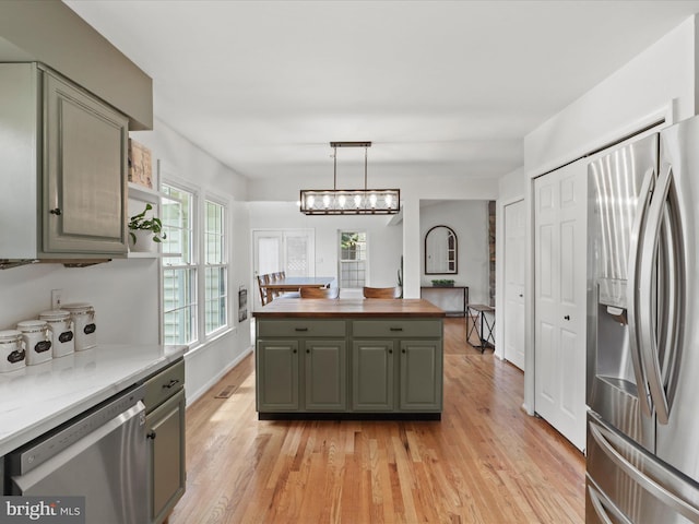 214 Primavera Cir, Sterling, VA 20165 - kitchen featuring gray cabinets, a center island, light wood-style floors, wood counters, and stainless steel appliances