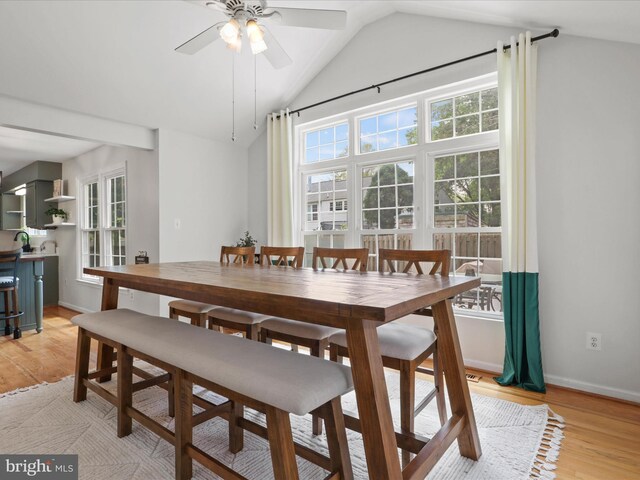 214 Primavera Cir, Sterling, VA 20165 - dining area featuring a ceiling fan, baseboards, lofted ceiling, and light wood-type flooring