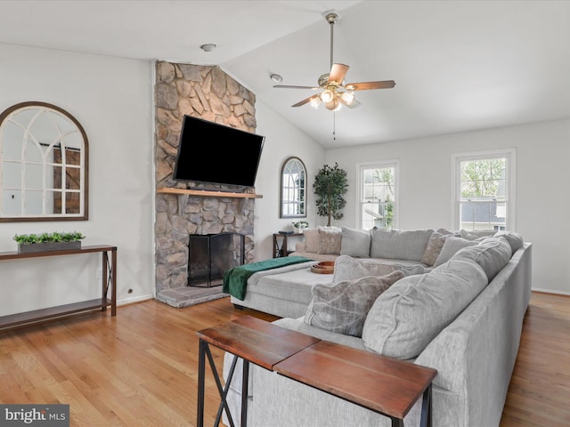 214 Primavera Cir, Sterling, VA 20165 - living area featuring a ceiling fan, lofted ceiling, a wealth of natural light, and a fireplace