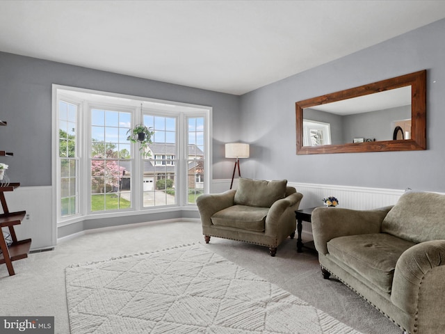 214 Primavera Cir, Sterling, VA 20165 - living room featuring carpet floors and a wainscoted wall