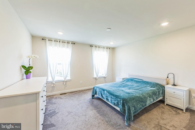 bedroom with recessed lighting, baseboards, and light carpet