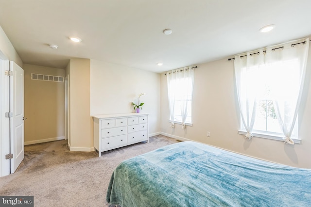 carpeted bedroom with visible vents, recessed lighting, and baseboards