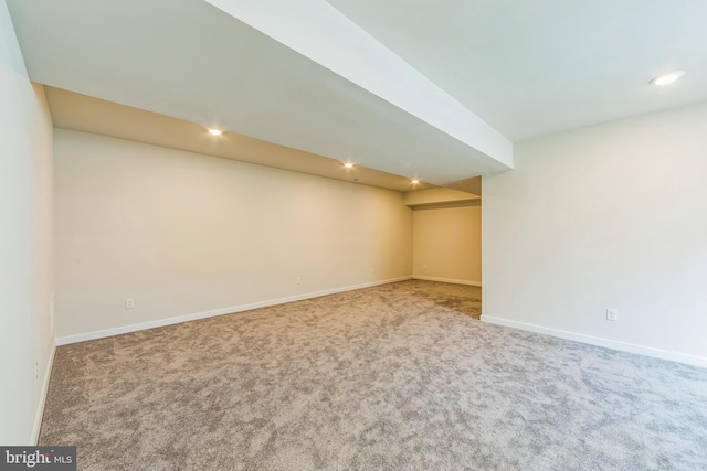 finished basement featuring carpet floors, baseboards, and recessed lighting