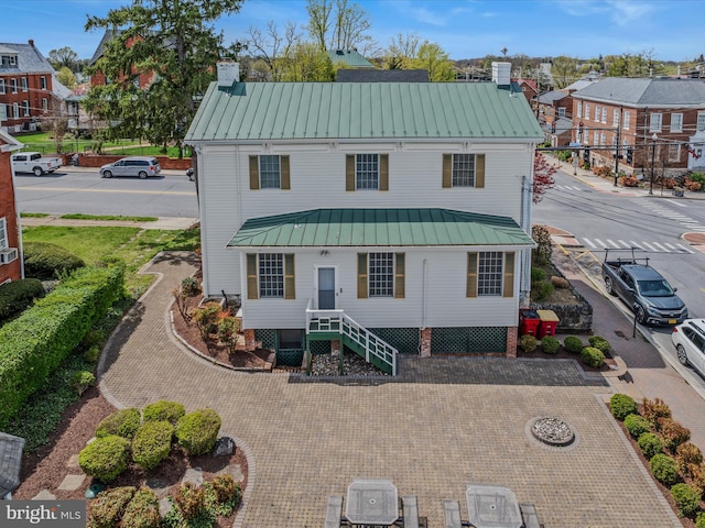203 S George St, Charles Town, WV 25414 - view of front facade featuring a chimney, a standing seam roof, a residential view, and metal roof