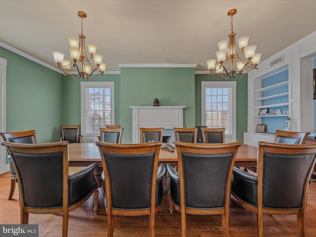 203 S George St, Charles Town, WV 25414 - dining area featuring visible vents, crown molding, and a notable chandelier