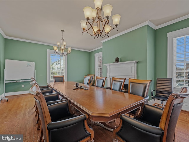 203 S George St, Charles Town, WV 25414 - dining room with an inviting chandelier, wood finished floors, ornamental molding, and baseboards