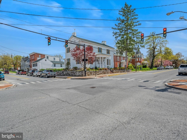 203 S George St, Charles Town, WV 25414 - view of street with curbs, street lighting, a residential view, sidewalks, and traffic lights