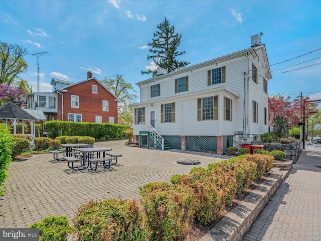 203 S George St, Charles Town, WV 25414 - back of property with a chimney