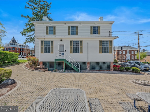 203 S George St, Charles Town, WV 25414 - rear view of house featuring a chimney