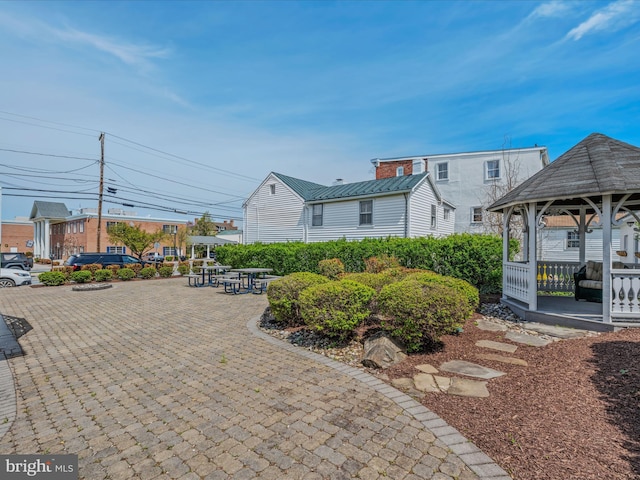 203 S George St, Charles Town, WV 25414 - exterior space with metal roof and a gazebo