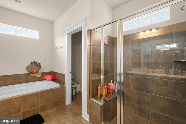 35898 Quantum Pl, Round Hill, VA 20141 - full bath with toilet, healthy amount of natural light, a shower stall, and tile patterned flooring