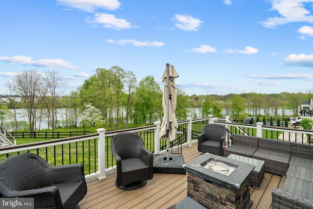 35898 Quantum Pl, Round Hill, VA 20141 - wooden deck featuring a water view, an outdoor living space with a fire pit, and view of wooded area