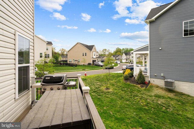 35898 Quantum Pl, Round Hill, VA 20141 - view of green lawn with a residential view, central AC unit, and a deck