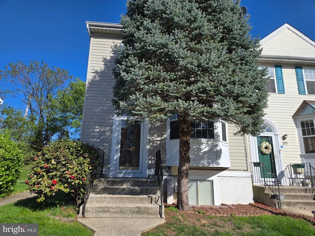 view of front of home with brick siding