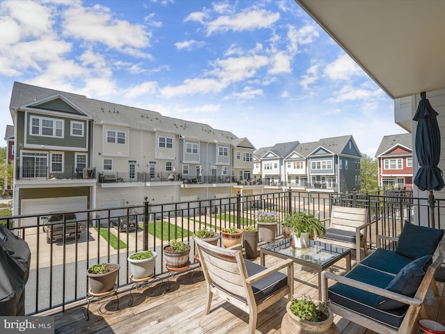 balcony with a residential view and an outdoor living space