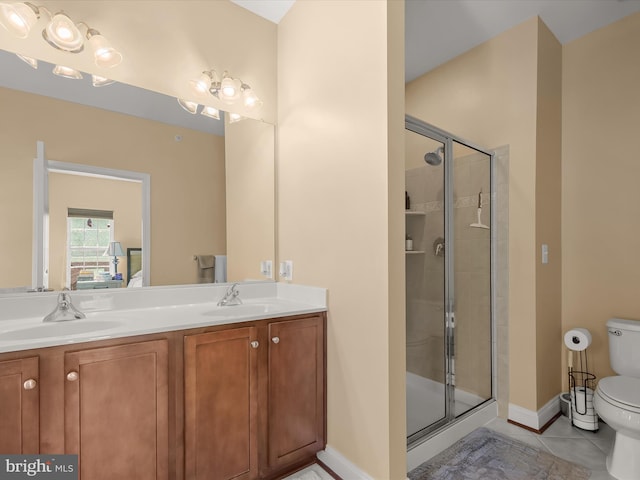 full bathroom featuring a sink, tile patterned floors, a stall shower, and toilet