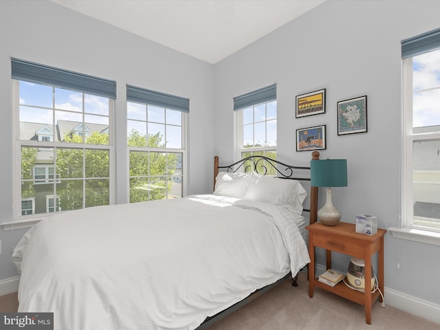 carpeted bedroom with baseboards