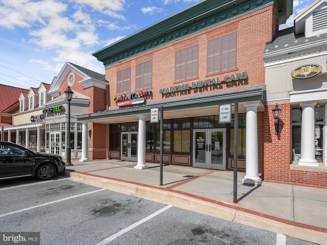 view of property featuring uncovered parking