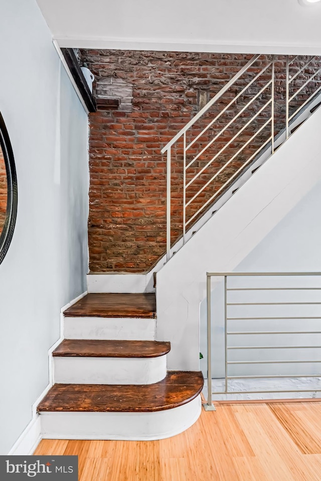 stairs with wood finished floors