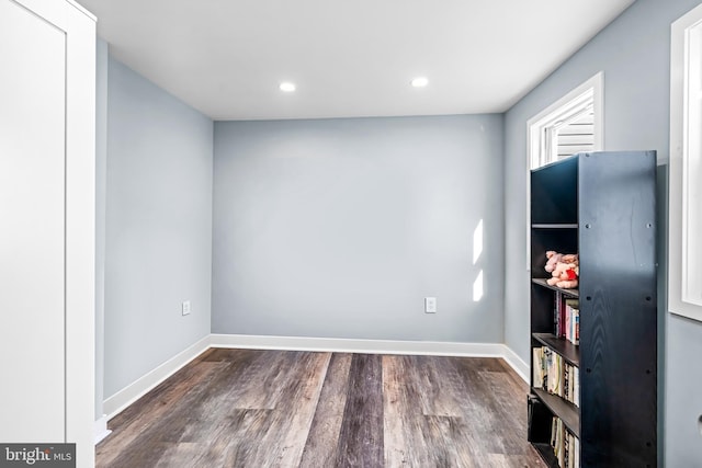 interior space featuring wood finished floors, recessed lighting, and baseboards
