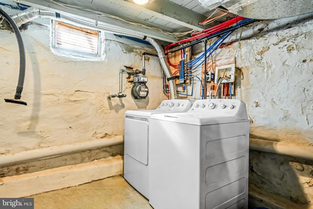 laundry room with separate washer and dryer and laundry area