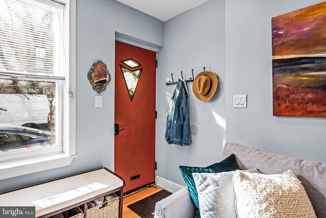 interior space featuring baseboards and wood finished floors
