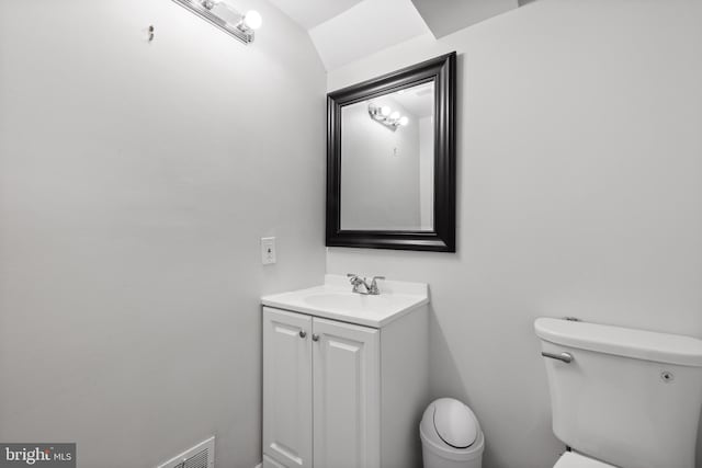 bathroom with toilet and vanity
