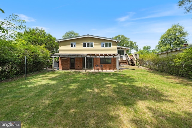 back of house featuring a patio, brick siding, stairway, and a wooden deck