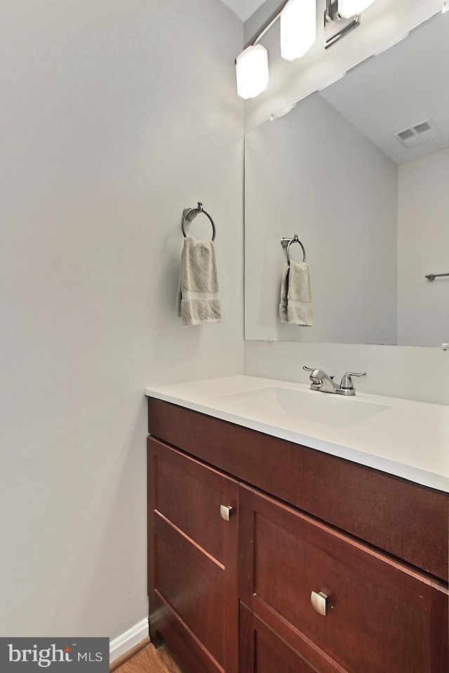 bathroom featuring vanity and baseboards