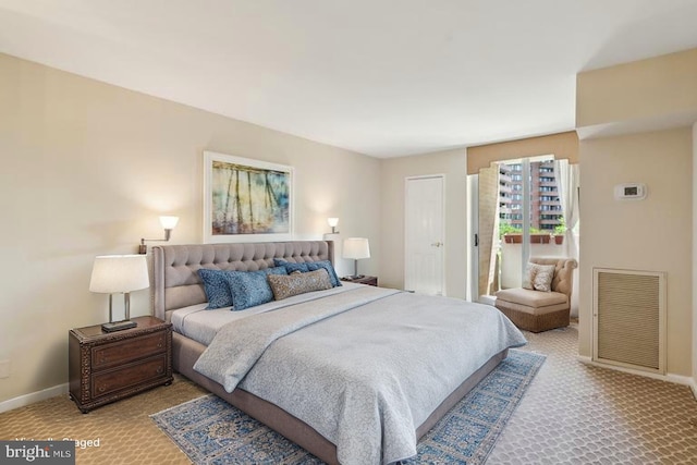 bedroom with carpet flooring and baseboards
