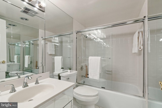 bathroom with shower / bath combination with glass door, toilet, and vanity