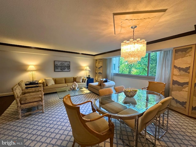carpeted dining room featuring crown molding, baseboards, and a chandelier