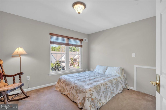 bedroom featuring visible vents, carpet, and baseboards