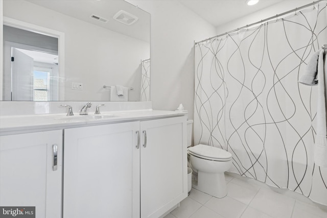 bathroom featuring curtained shower, visible vents, toilet, tile patterned floors, and vanity