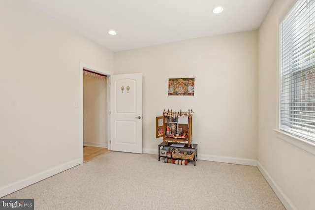 interior space with baseboards, recessed lighting, and carpet floors