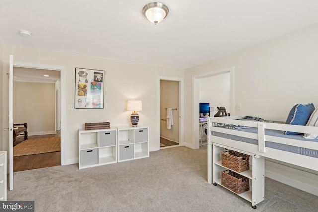 carpeted bedroom with baseboards