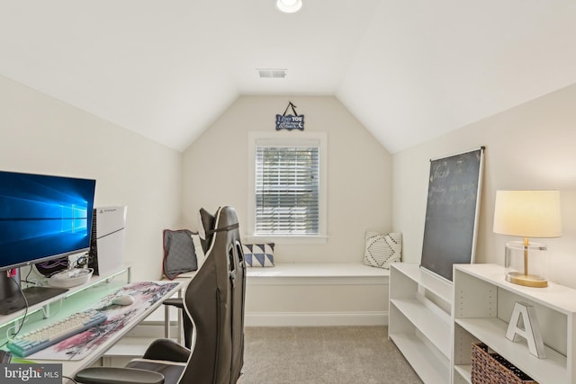office space with lofted ceiling, visible vents, and light carpet