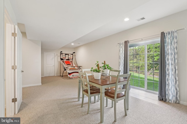 dining room featuring visible vents, baseboards, recessed lighting, and light carpet