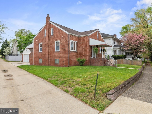 view of side of property featuring brick siding, fence, an outdoor structure, and a lawn