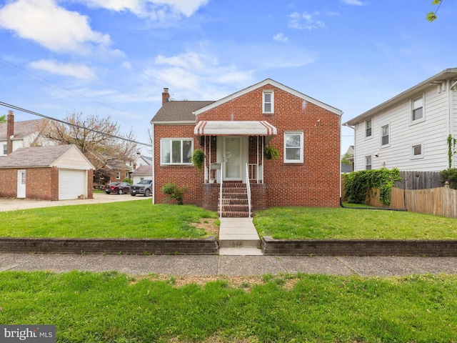 bungalow-style home with fence, a front lawn, a chimney, and brick siding
