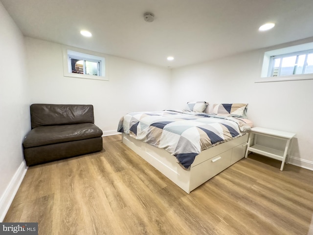 bedroom featuring recessed lighting, baseboards, and wood finished floors
