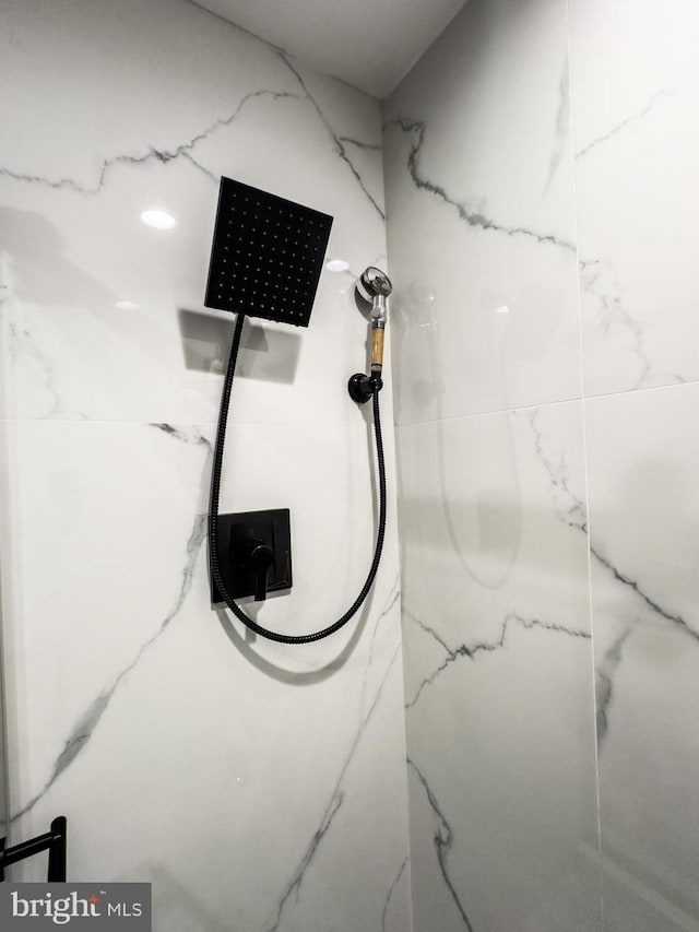 room details with a marble finish shower