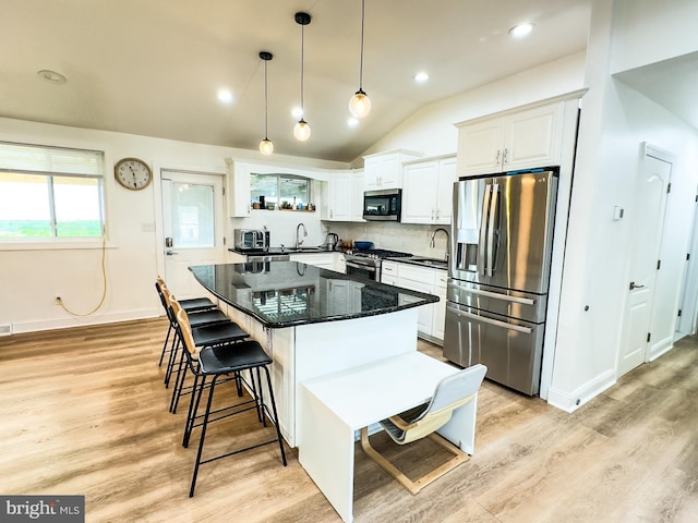 kitchen featuring a sink, stainless steel appliances, and light wood-style flooring