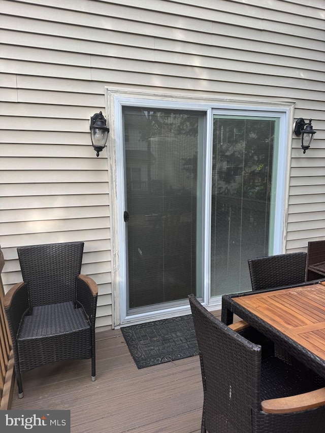 8800 Fenimore Pl, Bristow, VA 20136 - wooden deck featuring outdoor dining area