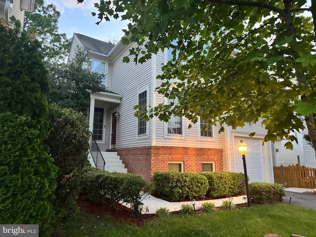 8800 Fenimore Pl, Bristow, VA 20136 - view of property exterior featuring brick siding and fence