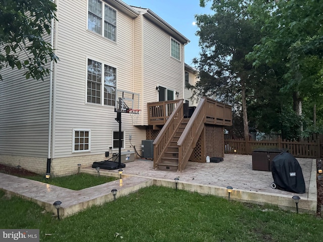 8800 Fenimore Pl, Bristow, VA 20136 - back of property with a patio area, fence, stairway, a deck, and central AC unit