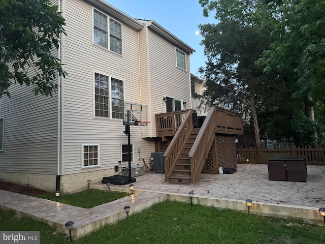 8800 Fenimore Pl, Bristow, VA 20136 - rear view of house with a patio area, stairway, a wooden deck, and fence