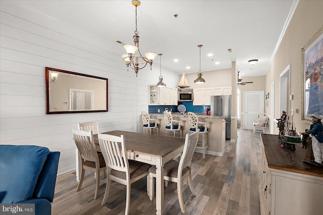 201 S Heron Dr Unit 9B, Ocean City, MD 21842 - dining area with recessed lighting, ornamental molding, ceiling fan with notable chandelier, and hardwood / wood-style flooring