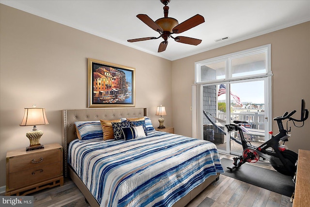 201 S Heron Dr Unit 9B, Ocean City, MD 21842 - bedroom with visible vents, ornamental molding, wood finished floors, access to exterior, and a ceiling fan